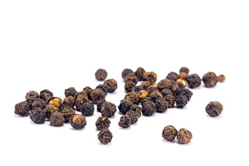 black pepper grains isolated on white background