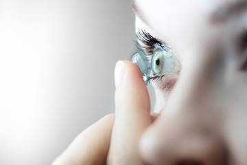 girl wearing soft contact lenses close-up macro