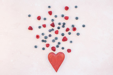 Valentine Day composition berries and red heart