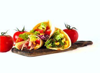 Traditional dish of Mexican cuisine. Corn tortilla tacos with vegetable filling on isolated white background.
