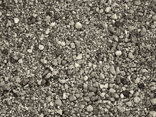 brown toned monochrome sepia beach pebble background with different shapes and colors