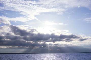 Naklejka na ściany i meble Sea surface and dramatic blue cloudy sky after storm. Nature background