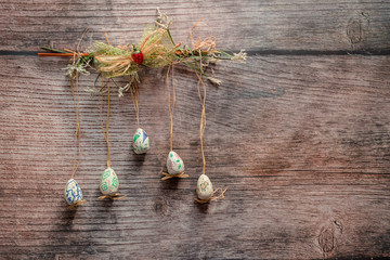 Easter decorative concept with colorful eggs hanging on the wall