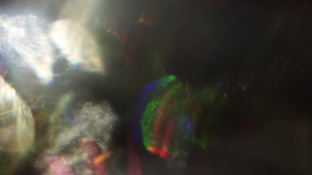 Psychedelic background, abstract play of rainbow colors in the dark.