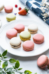 Macaron or French macaroon cookies dessert. Set on cafe table.