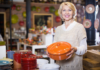 Woman customer posing with ceramic cookware
