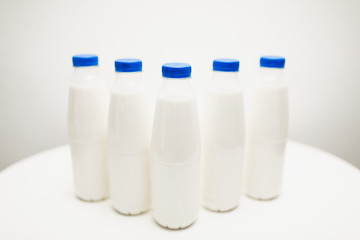 milk bottles on white table