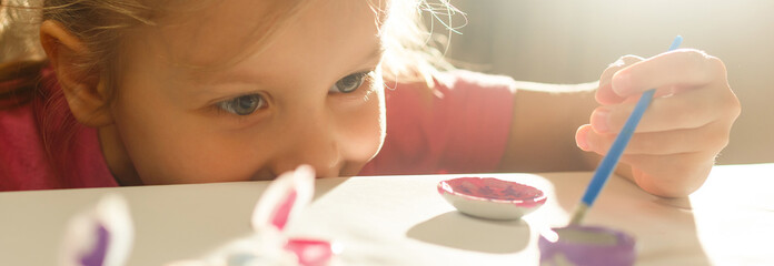 Little girl drawing closeup shot