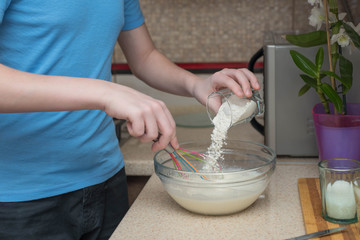 teenage boy cooking at home.