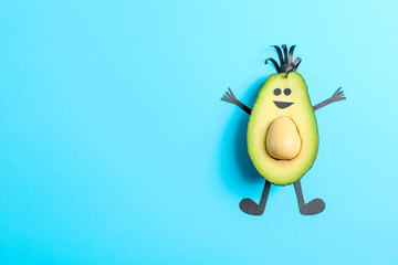 Happy avocado on color background, space for text