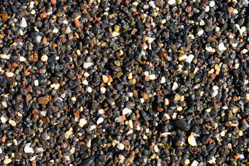 Textured surf and pebble at a beach of Gran Canaria island