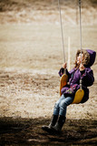 girl on a swing at winter