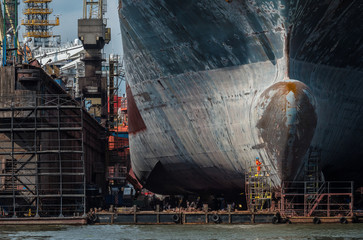 Gdansk shipyard with monumental bow of cargo ship.