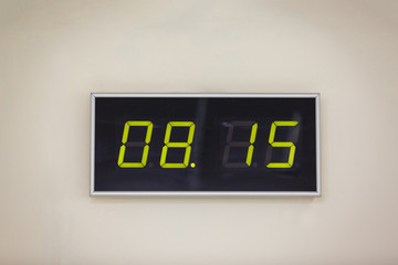 Black digital clock on a white background showing time 08.15 minutes