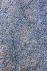 Granite texture close up. Granite rocks with porous surface. Background from solid stone. Pattern with natural material