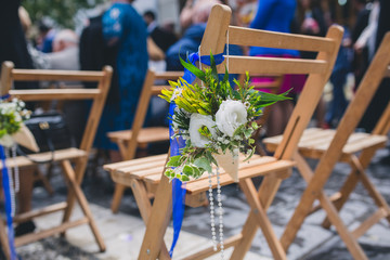 flowers in chairs wedding decoration