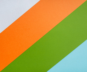 Background made up of strips of multicolored watercolor paper. Diagonal.