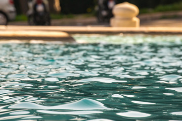 Closeup of a water fountain - water, ripples, splash and a cool color of blue. Background, refreshing. This fountain is found in Rome Italy Trastevere neighborhood in the park above the city