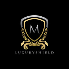Golden Shield M Letter Logo