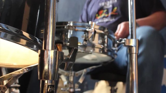 Drummer plays a pattern, blured,  hd