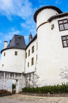 The buildings of Clervaux Castle on a cloudy February day, exterior partial view