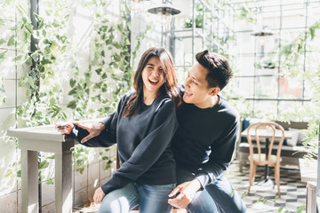Happy Asian couple in love having fun