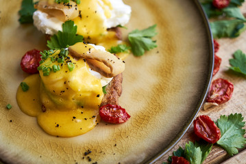 Healthy spring breakfast food with avocado toast, poached egg
