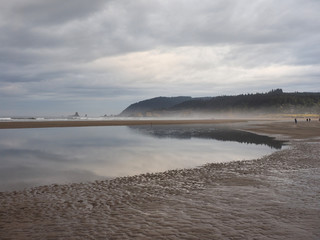 Cannon Beach, Oregon, at extreme low tide on an overcast autumn day.