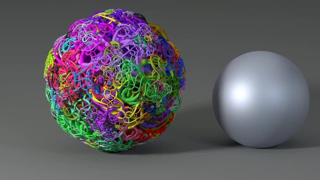 Simple versus complex. Multi-coloured fractal sphere next to a simple metallic ball.