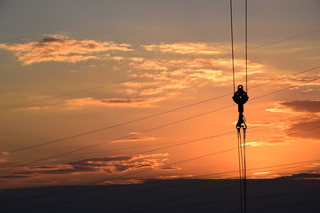 silhouette of construction crane at sunset