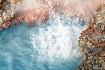 Reykjadalur, Iceland Hveragerdi Hot Springs abstract closeup of turquoise color steam fumarole vent in golden circle with nobody on hiking trail
