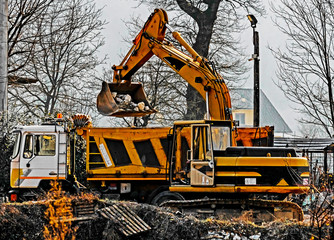 heavy construction equipment working in industrial site in rural area of Italian region of Lazio