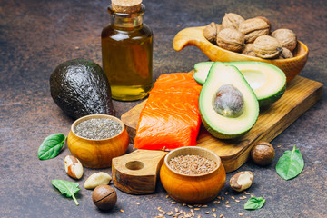 Animal and vegetable sources of omega-3 acids as salmon, avocado, linseed, oil, nuts, chia seeds,...