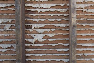 Exposed lathe and mortar from an old wall