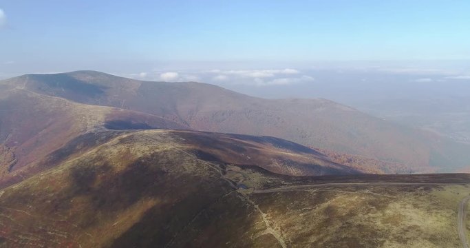 Aerial view: Flying over an amazing mountain near the peak of Gemba. 4k