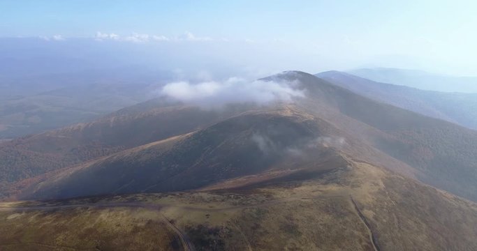Aerial view: Flying over an amazing mountain near the peak of Gemba. 4k