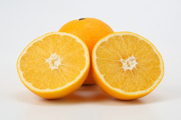 Cut citrus fruit of orange on white background