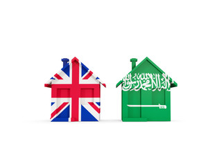 Two houses with flags of United Kingdom and saudi arabia