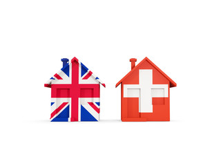 Two houses with flags of United Kingdom and switzerland
