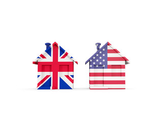 Fototapeta premium Two houses with flags of United Kingdom and United States