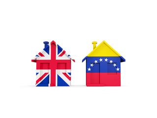 Two houses with flags of United Kingdom and venezuela