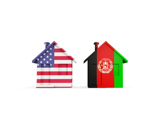 Two houses with flags of United States and afghanistan