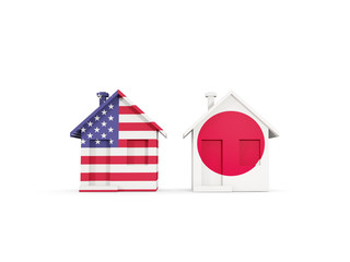 Two houses with flags of United States and japan