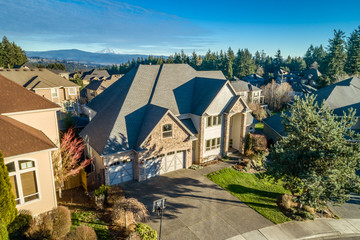 Fototapeta na wymiar Luxury home in the Pacific Northwest photographed with a drone at sunset