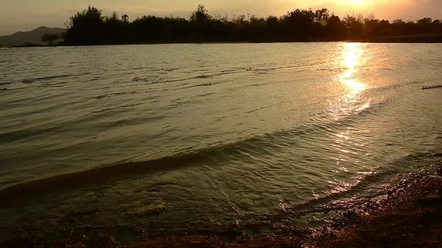 Wave and marsh at  Lake in Thailand, at sunset. 4K UHD