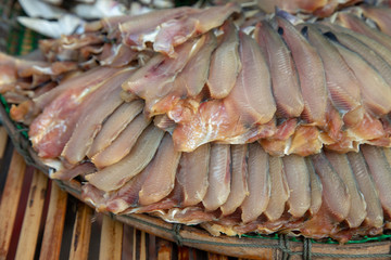 dry fresh fish on basket and sun Thai tradition