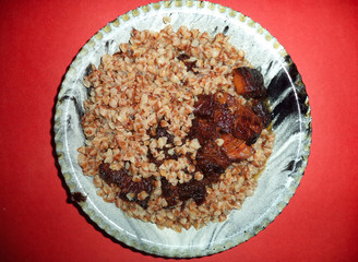 roast meat with garnish of boiled buckwheat