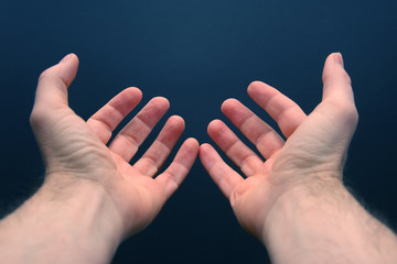 outstretched arms with open palms