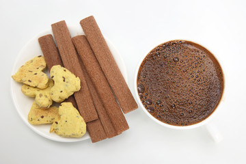 cup of hot coffee with biscuits