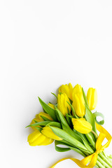 Spring composition. Bouquet yellow tulips on white background top view space for text